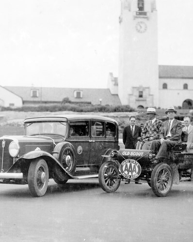 Black and white photograph of men and cars by Boise Train Depot circa 1930s or 40s