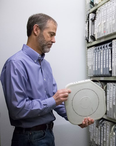 Person holding archival film