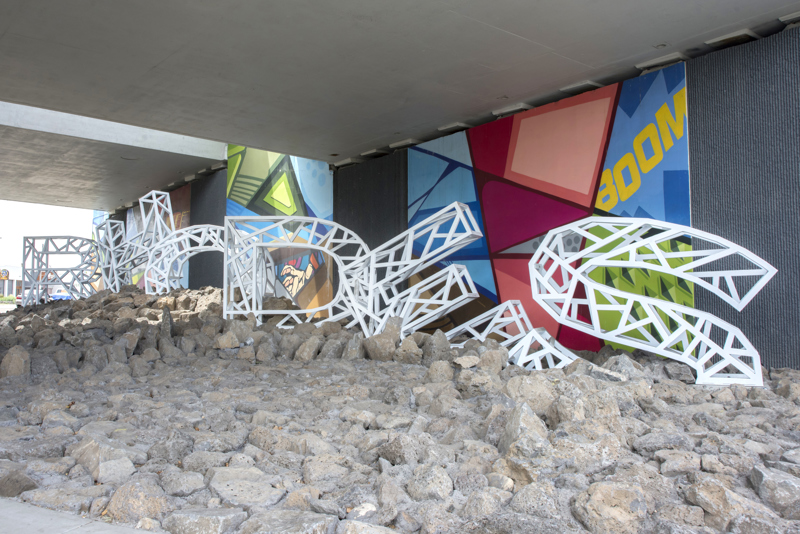 A large installation of the name "Rhodes" made from white painted steel. 