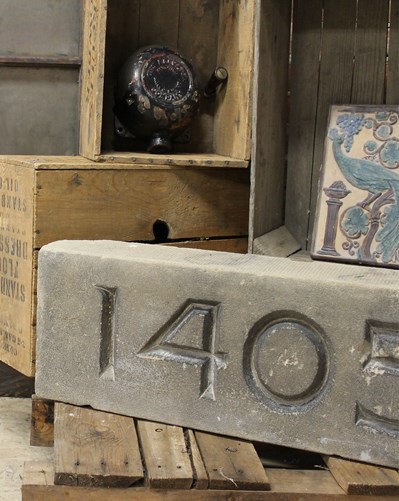 Photograph of boxes and large metal numbers