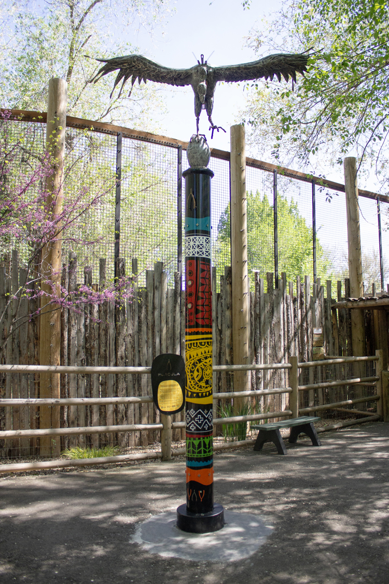 A sculpture of a flying vulture made of found metal materials. On its breast is a wish bone. 