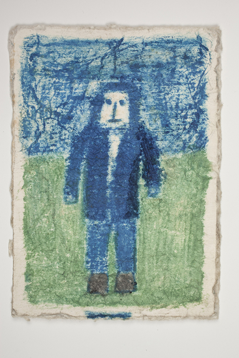 A drawing of a figure in blue on the back of a piece of cardboard from a "Certi-Fresh" ice cream box. 
