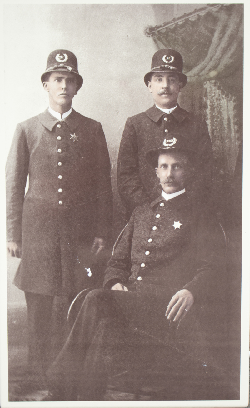 An image of a line of a police chief and two officers from 1897.