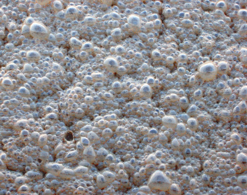 A closeup photo of pearlescent bubbly foam.
